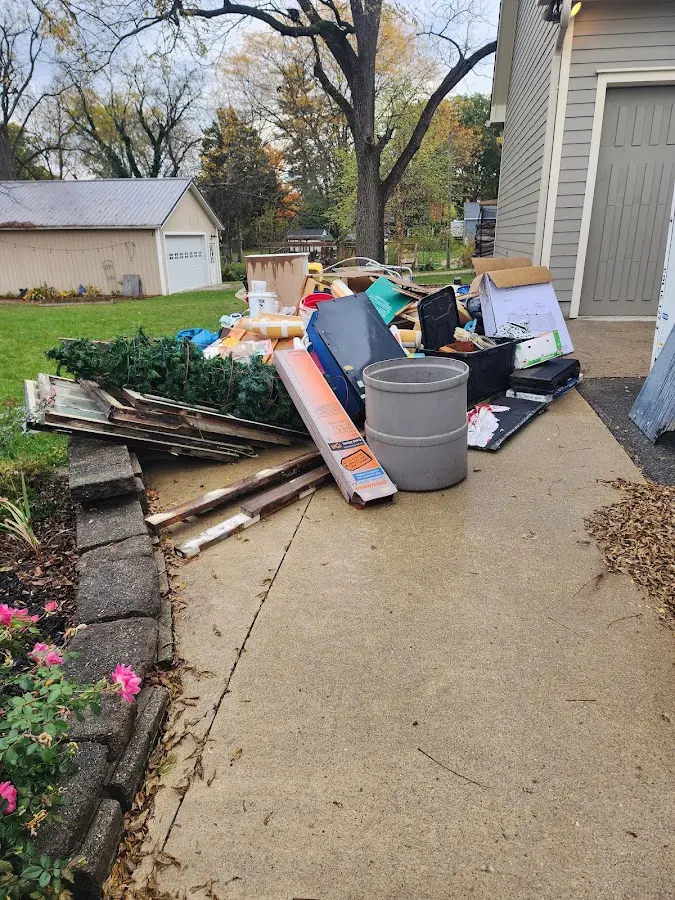 Dumpster being loaded with debris for 3 Yard Dumpster Rental in Plattekill